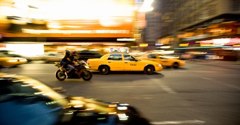 Image of a motorcycle riding in traffic