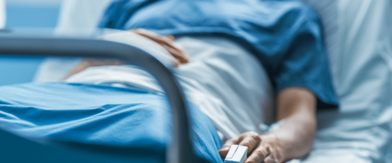 Image of someone lying in a hospital bed